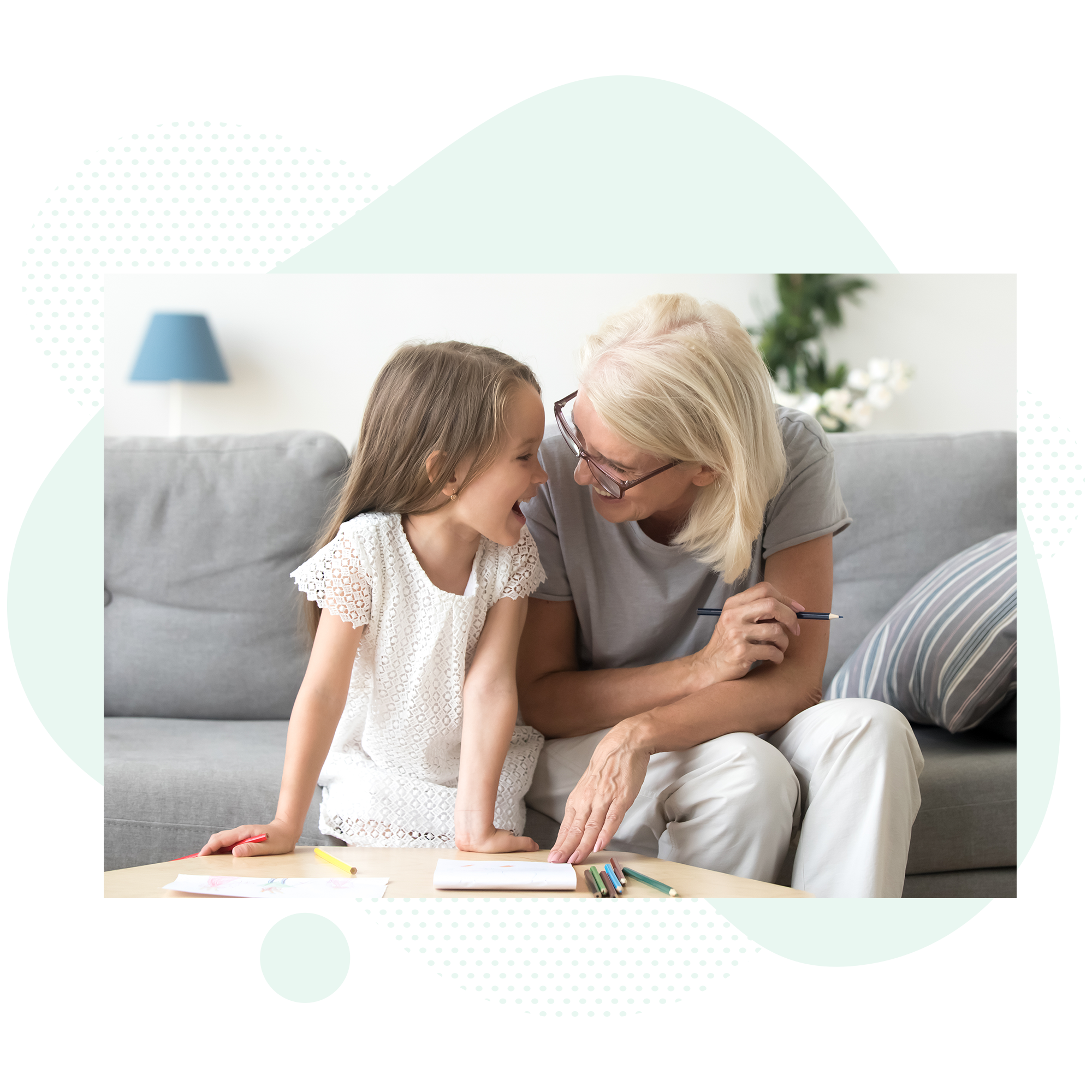 Girl and grandmother coloring together