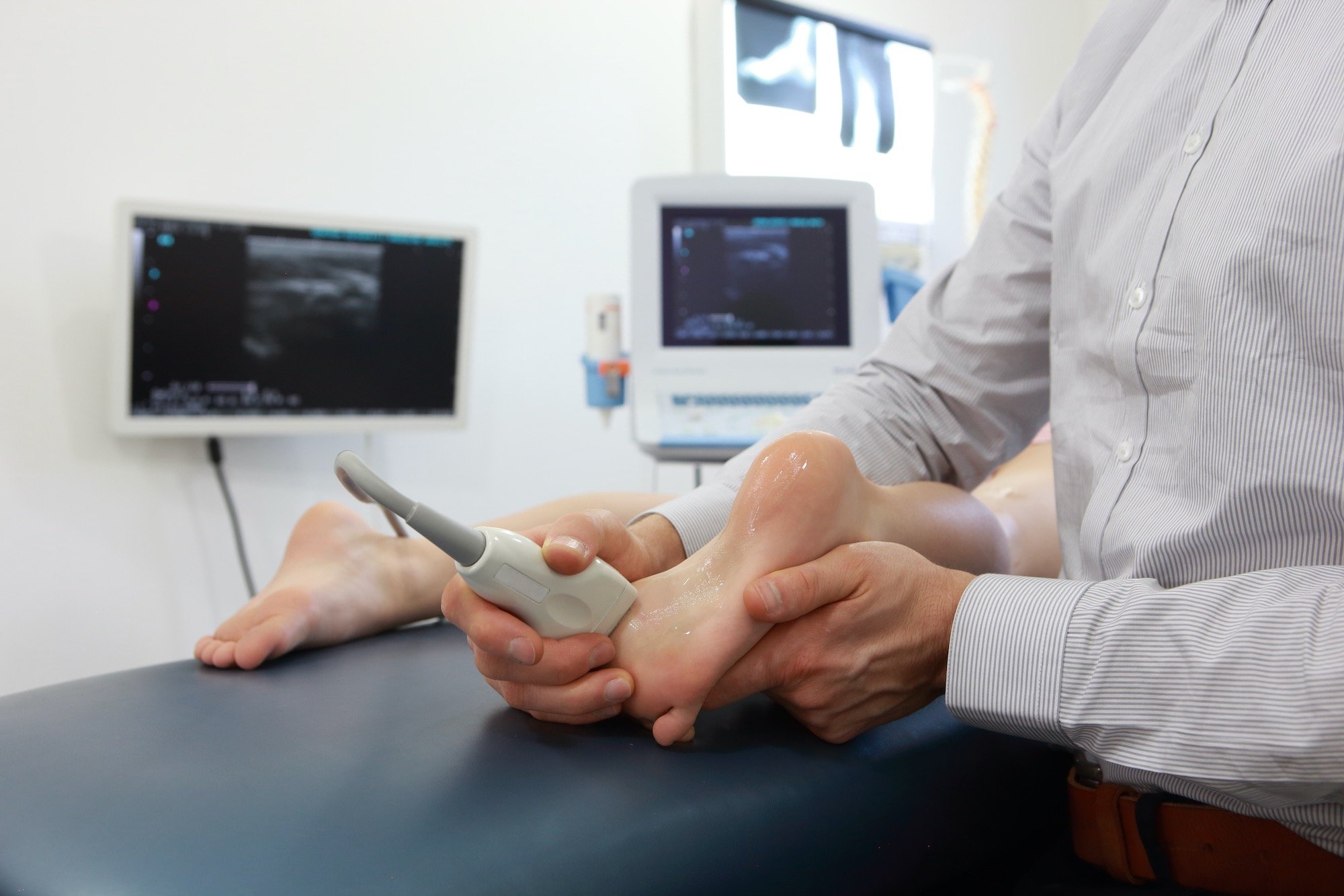 pediatric-podiatry-young-boy-getting-treatment_afd Pediatric Patient Receiving Foot Pain Ultrasound