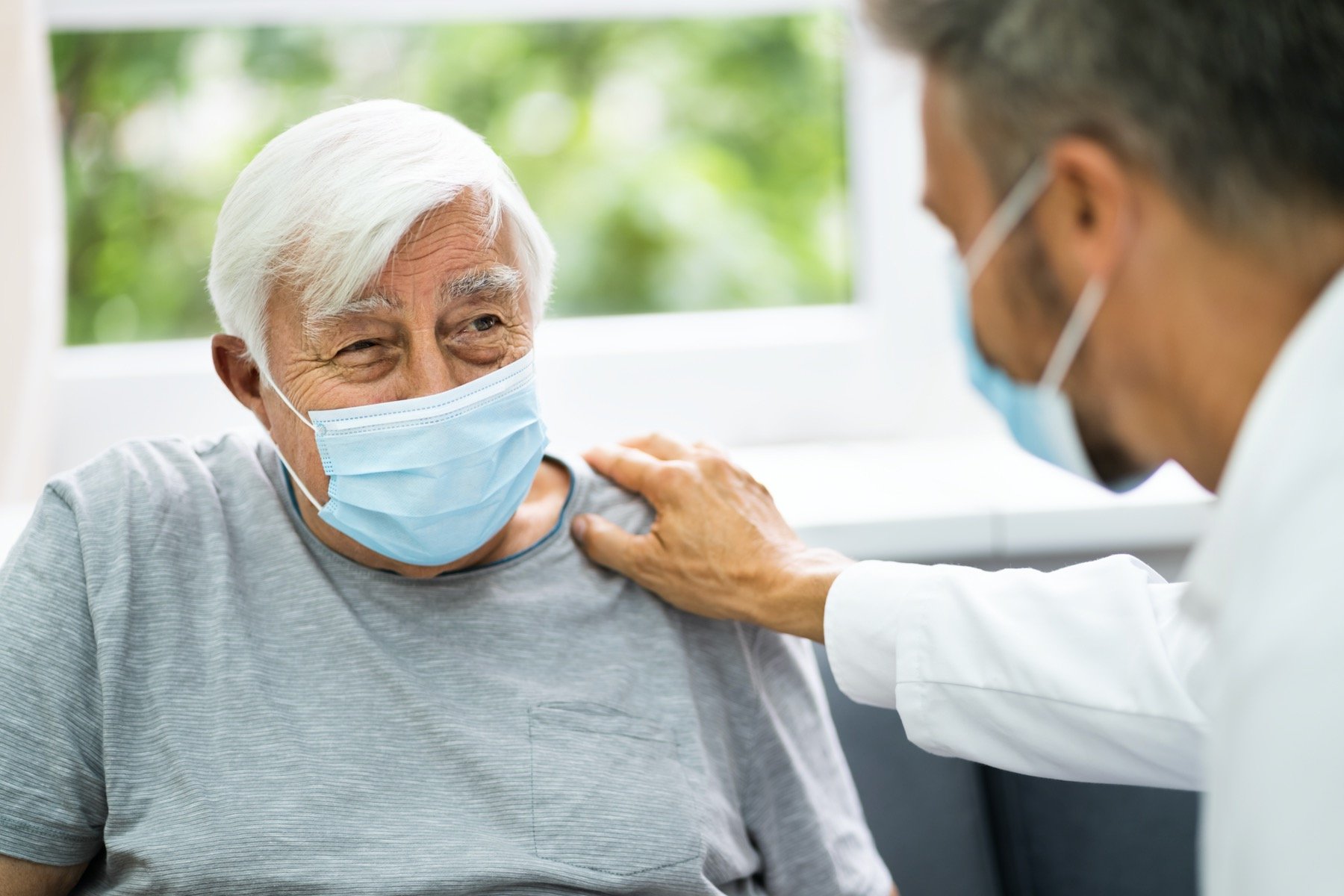 Older Patient Talking With Doctor About Bone Spur Treatment Options